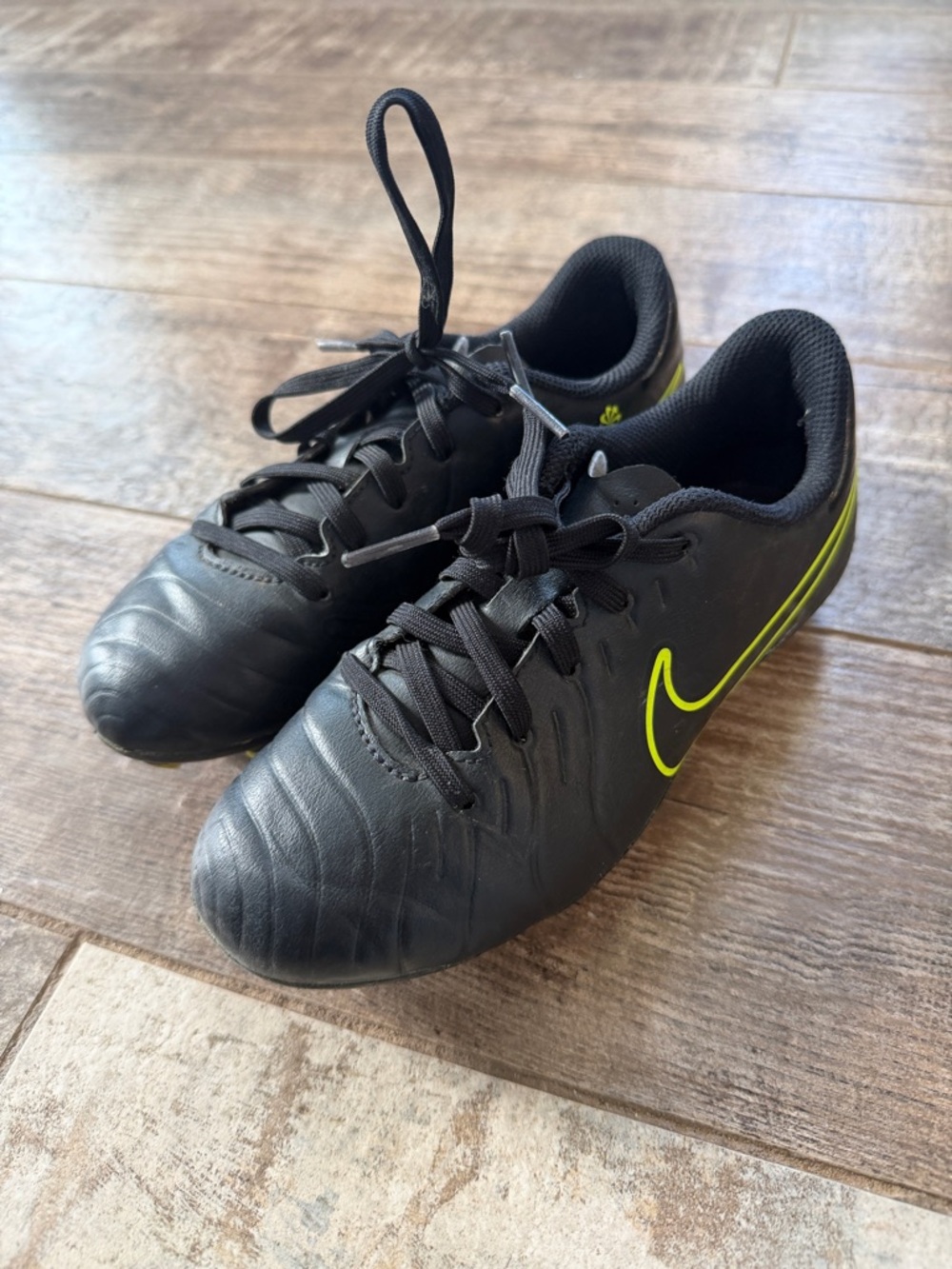 Nike Black Soccer Cleats with Neon Yellow Swoosh Accent
